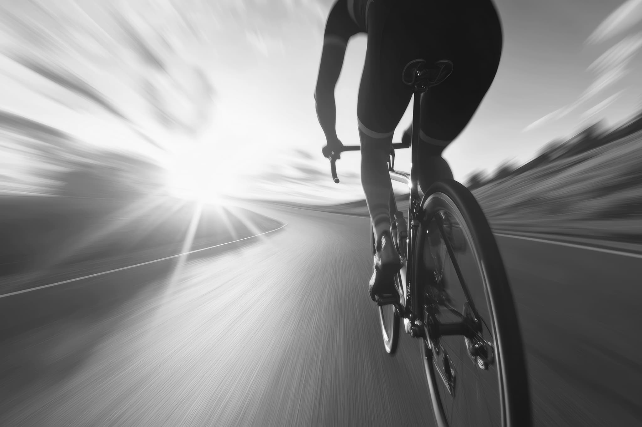 Cyclist rides briskly along a winding road